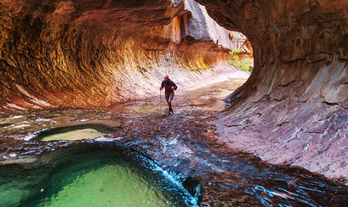 A man discovering an underground river